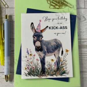 Greeting card featuring a cute donkey in a party hat with message "Hope your birthday is as KICK-ASS as you are!"