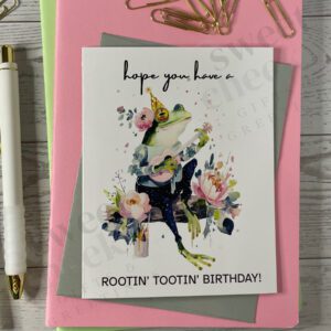 Greeting card featuring Rootin' Tootin' Birthday Country frog playing blue grass acoustic guitar in the woods
