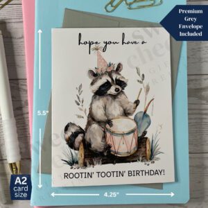 Greeting card featuring Rootin' Tootin' Birthday Country raccoon playing blue grass drum in the woods
