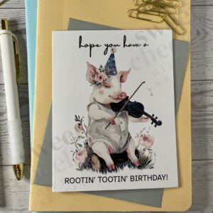 Greeting card featuring Rootin' Tootin' Birthday Country pig playing blue grass violin in the woods