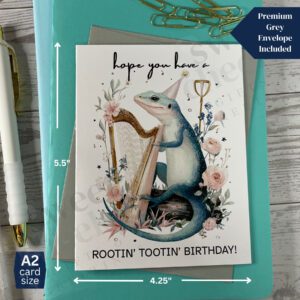 Greeting card featuring a Rootin' Tootin' Birthday Country Lizard playing blue grass harp in the woods