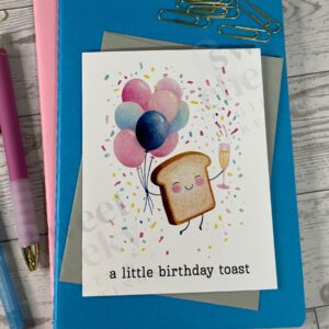 Greeting card featuring small toast holding champagne and balloons with message "a little birthday toast"