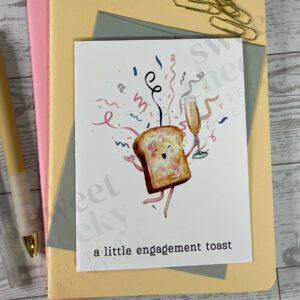 Greeting card featuring small toast holding champagne and celebrating with message "a little engagement toast"