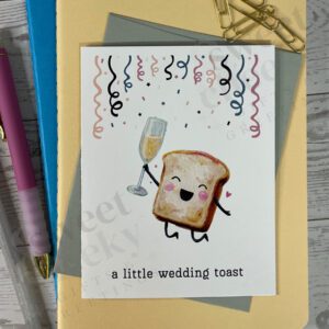 Greeting card featuring a happy small toast holding a glass of champagne with message "a little wedding toast" and celebrating