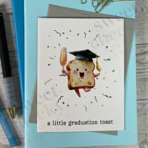 Cute greeting card featuring small toast wearing a graduation cap with a glass of champagne celebrating graduate