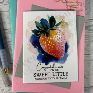 new parent greeting card featuring message "congratulations on the sweet little addition to your family" and a sweet strawberry