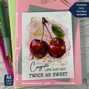 greeting card featuring 2 cherry fruits attached at the stem with the message for new parents "congrats life just got twice as sweet"