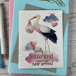 Greeting card with message "totally storked about your new arrival" featuring a stork delivering a baby