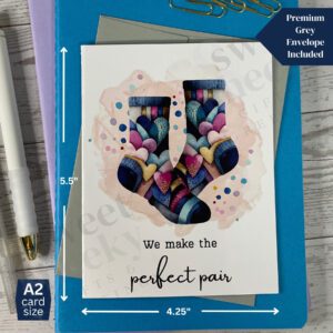 Geeting card that says "we make the perfect pair" and features colorful socks covered in hearts