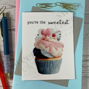 Sweet cupcake with frosting decorations and a cherry on top and says "you're the sweetest" Greeting card