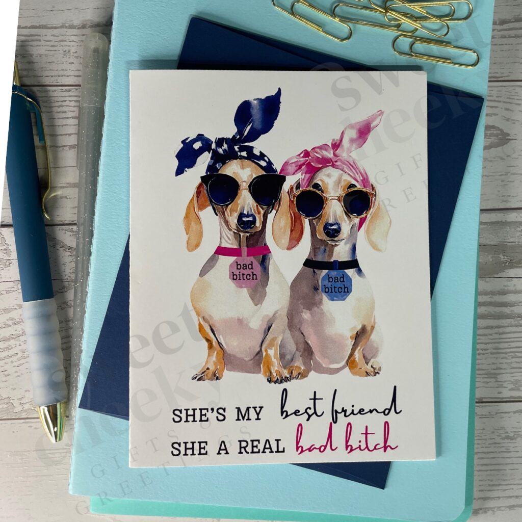 greeting card with two cute weenie dogs with message "She's by best friend, she's a real bad bitch"