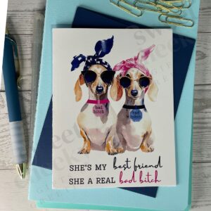 greeting card with two cute weenie dogs with message "She's by best friend, she's a real bad bitch"