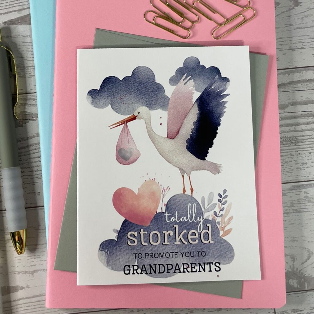 Greeting card featuring stork delivering a baby that says "totally storked to promote you to Grandparents"